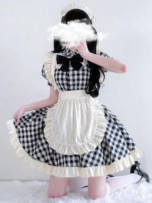 Gingham lolita maid dress side three-quarter view showing puff short sleeves black bow collar and frilled apron detail