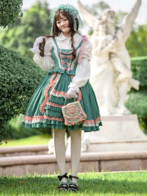 Sweet lolita green dress with coordinating handbag, front standing pose, white inner blouse, white stockings, and black bow shoes in botanical garden background