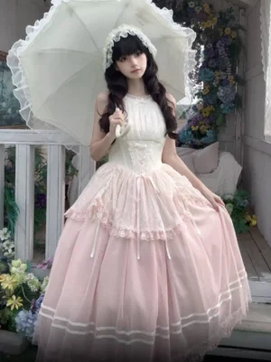 Pink halter sweet lolita jsk dress front view full body model vintage floral balcony setting with white lace parasol and gradient tulle tiered skirt