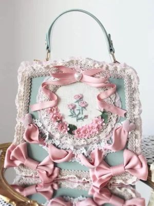 Mint green sweet lolita PU leather handbag with pink satin bows and floral embroidery on golden tray