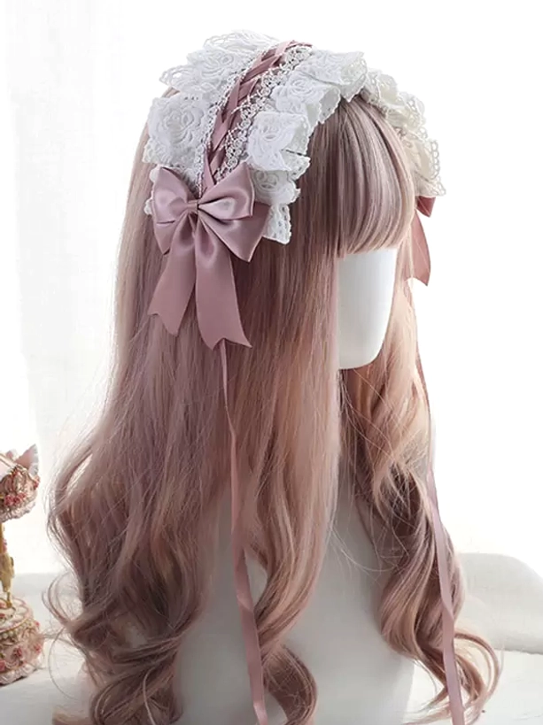 Romantic Sweet Lolita headband featuring white delicate lace with dusty pink satin bow and matching pink braided trim accents, displayed on mannequin with pink wavy hair against cute decor background, three-quarter angle