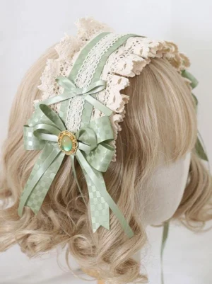 Sweet lolita headdress side rear view featuring sage green checkered satin bows with cream ruffled lace trim and decorative gem brooch on blonde wig mannequin