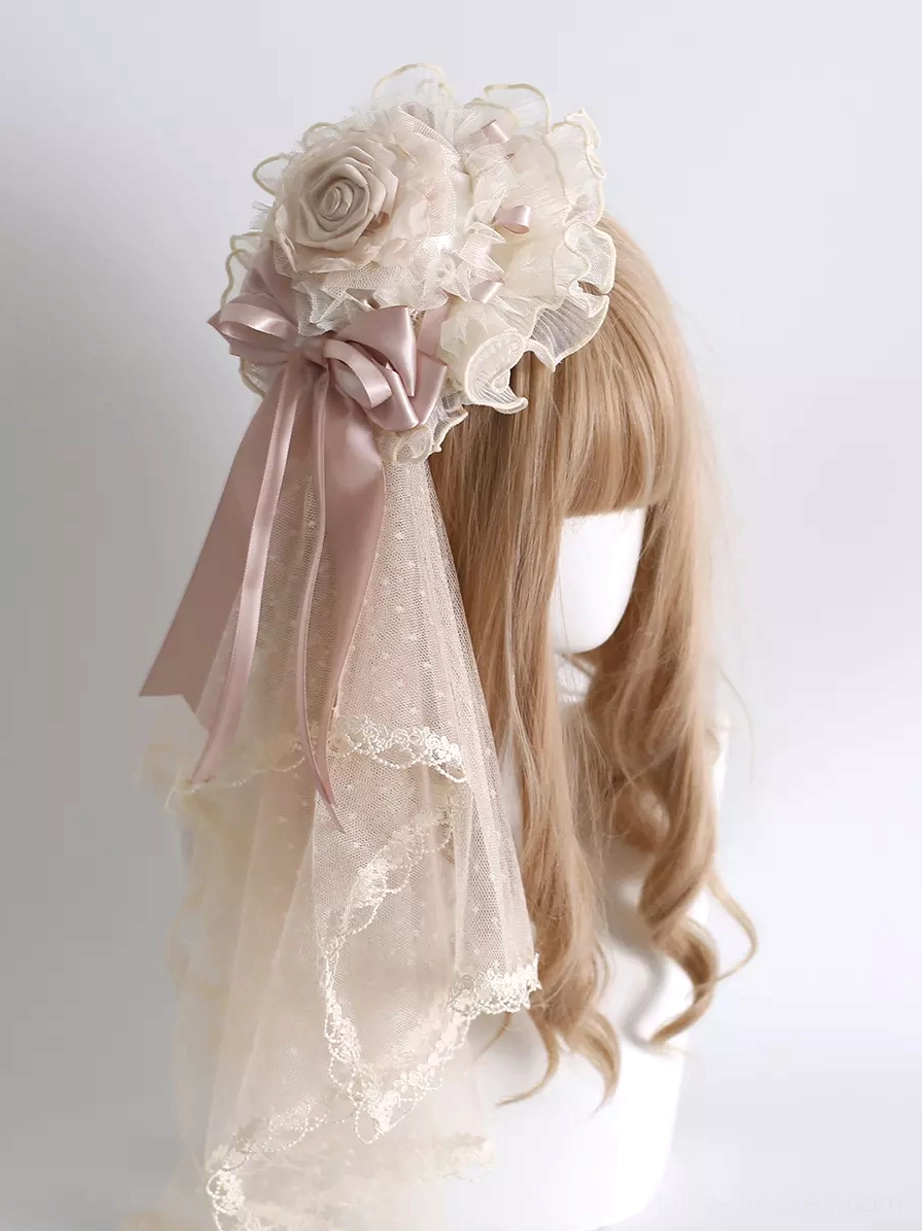 Sweet lolita headpiece dusty pink satin bow with ivory tulle veil and lace trim worn on blonde wig mannequin rear view