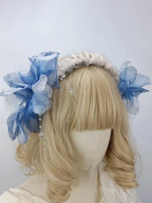 Royal blue organza floral lolita headdress with beaded decorative pendants, elegant three-quarter view showcasing intricate flower details and embellishments