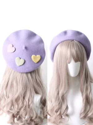 Purple sweet lolita heart beret with pastel heart appliqués displayed on mannequin head showing front and side angles