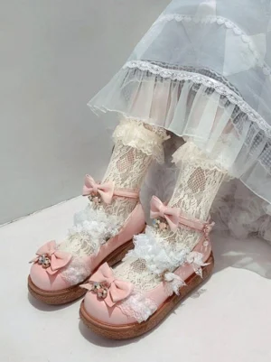 Pink sweet Lolita heels side profile showing ankle strap buckle lace decoration and brown rubber sole with coordinated ruffled socks