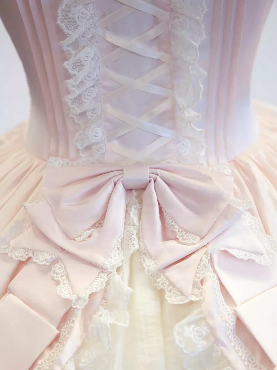Back full-body view sweet lolita jumper dress big bow layered ruffled hem indoor flower shop blonde wig model