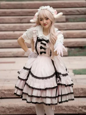 Sweet Lolita JSK dress three-quarter front view showing chest lace-up bow corset design on model with sheep horn headdress outdoor stone stairs setting