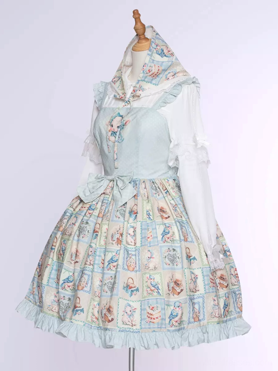 Sweet lolita sheep bird cake print JSK dress detail view showing fabric texture, print quality, ruffled hemline construction, bow embellishment, and light blue color saturation