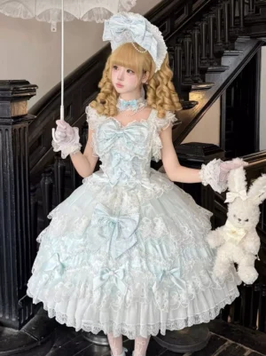 Sweet lolita dress three-quarter front angle showing matching hair bonnet, choker, frilled neckline, and layered skirt detail