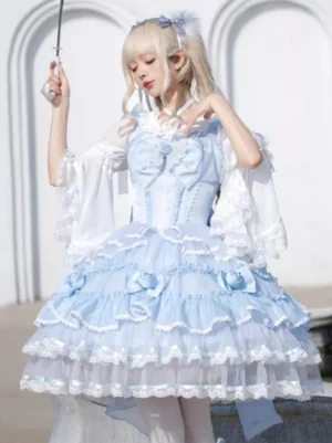 Sweet Lolita jumper skirt dress with inner blouse light blue fitted waist flared sleeves outdoor European arch setting