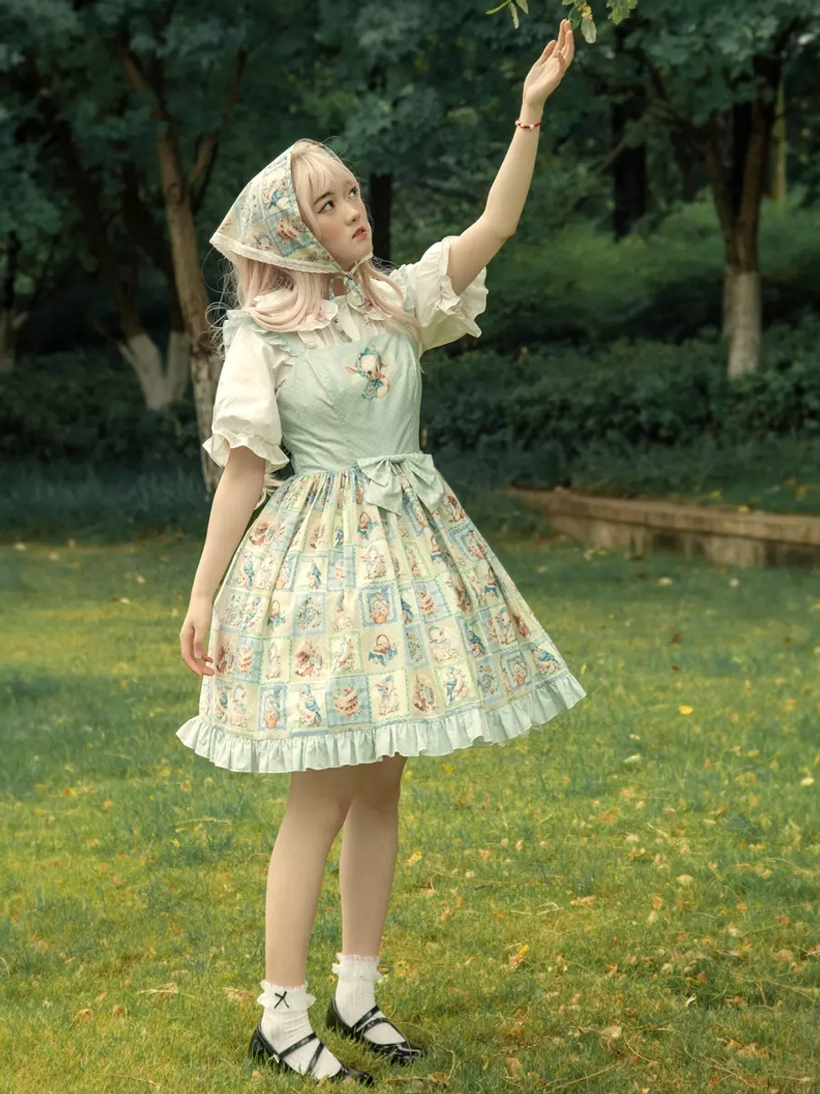 Side full body view of sweet lolita JSK with raised arm pose showing ruffled skirt hem, square print pattern, matching headscarf, and graceful silhouette outdoor lawn