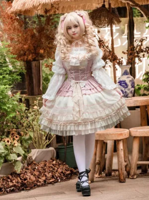 Blonde curly-haired model wearing sweet lolita jumper skirt dress styled with white long-sleeve inner blouse white knee-high stockings and black platform shoes in outdoor courtyard with thatched awning garden setting