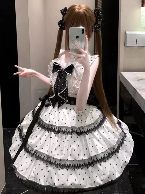 Sweet lolita polka dot JSK dress side front angle showing square neckline waist sash and tiered lace trim design