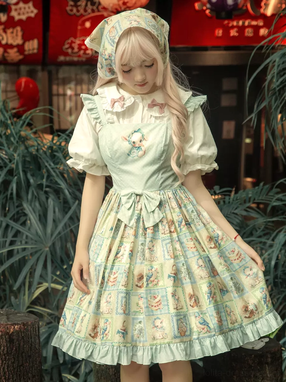 Three-quarter front angle of sweet lolita dress set featuring square cartoon print, matching printed headscarf, ruffled hemline, and waist bow decoration outdoor storefront setting