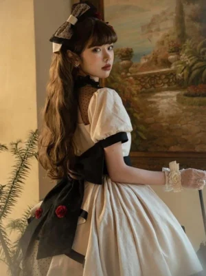 Sweet Lolita dress back three-quarter view showcasing large black back bow, sheer mesh back panel detail, and romantic garden-inspired floral design for authentic lolita fashion