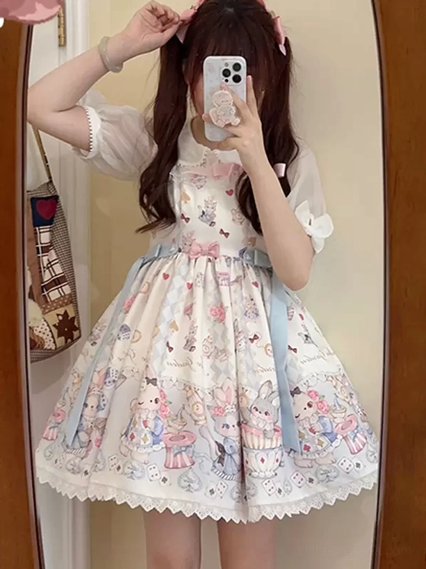 Mirror selfie of sweet lolita jsk with short puff sleeve blouse pastel cartoon print and blue side sash indoor fitting room