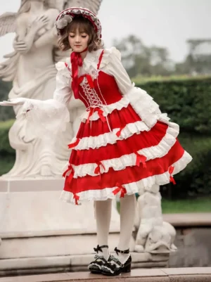 Sweet lolita jumper dress red white color-blocked design tiered lace ruffles left side full-body view garden setting