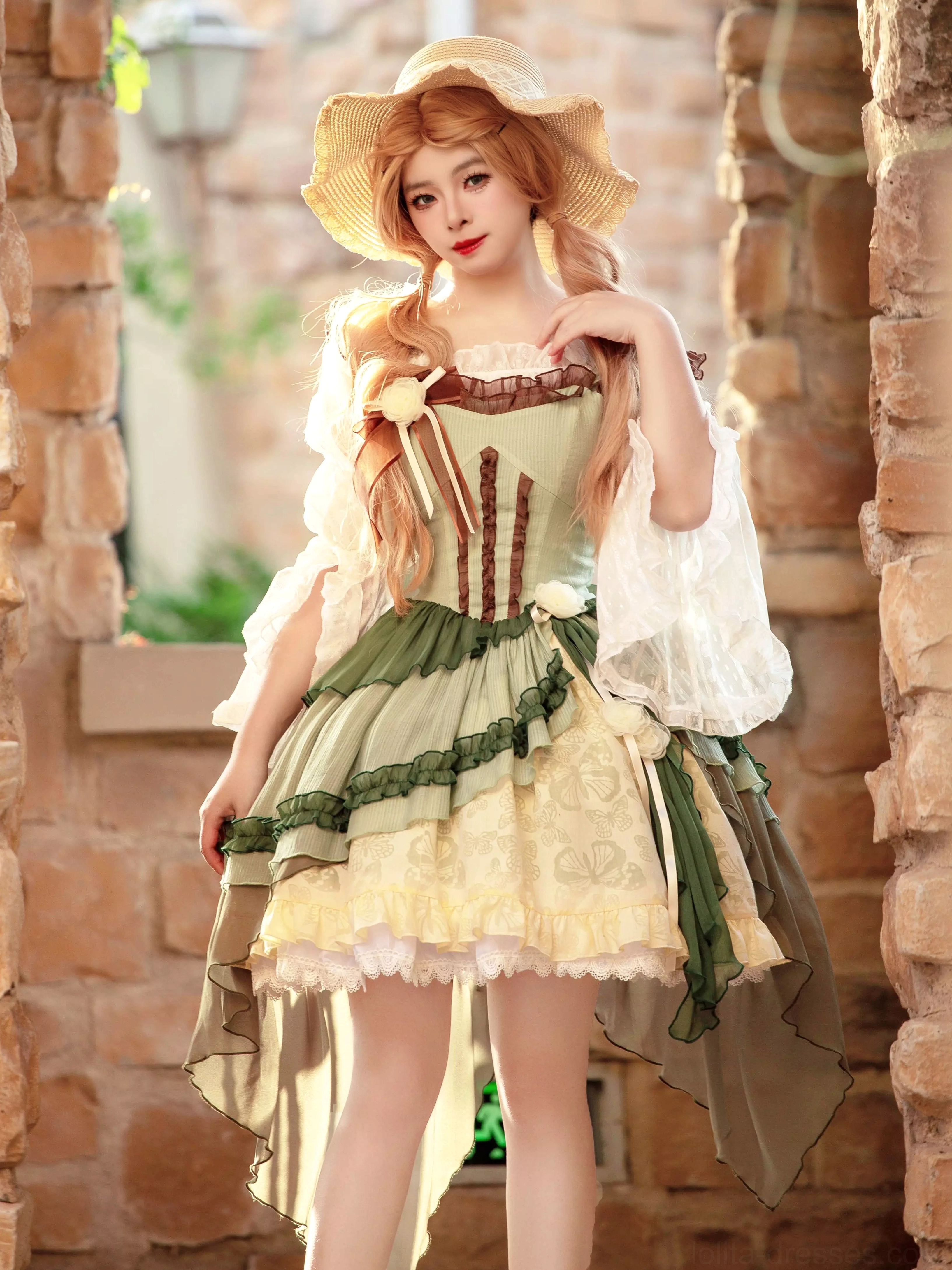 Sweet lolita jumper skirt full-body shot displaying high-low hem and brown corset-style bodice details on stone wall background