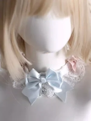 Sweet Lolita lace choker front close-up view on mannequin with blonde bob wig, featuring white lace collar with light blue satin bow, pink fabric side bows, and central rhinestone charm pendant