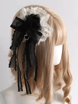 Sweet Lolita black and white lace headband with organza bow and pearl pendant displayed on blonde mannequin head rear three-quarter view