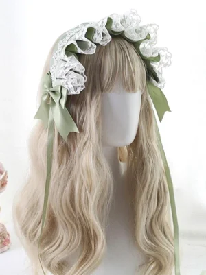 Sweet Lolita lace headband headdress with green-white color scheme, ruffled lace trim, and satin bow with long streamers on blonde mannequin model