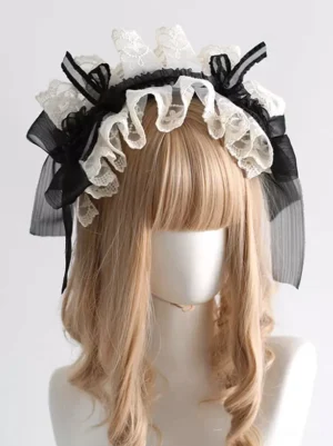 Sweet Lolita lace headdress front view with off-white ruffled lace and black sheer ribbon bows displayed on mannequin with blonde wig against white background