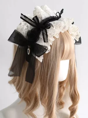 Sweet Lolita lace headdress side rear view showing dangling rhinestone pendant accent on bow displayed on blonde wig against white background