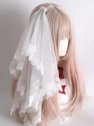 White layered lace sweet lolita hair veil with scalloped trim displayed on mannequin with ombre pink-blonde wig, showing left three-quarter angle view of delicate dotted tulle construction