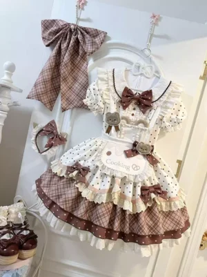Maid-inspired sweet lolita dress side front angle showing layered ruffle tiered skirt plaid details with polka dot short sleeves and coordinating accessories