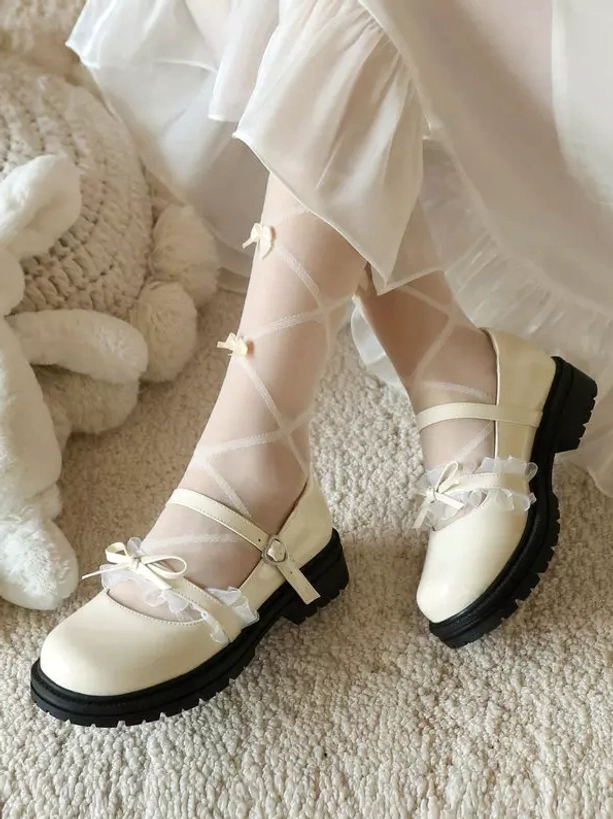Light apricot lolita mary jane shoes overhead double feet view with mesh ruffle bow and thick black sole, paired with crisscross sheer stockings