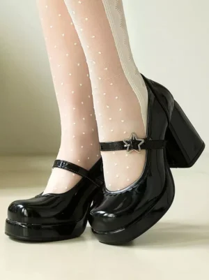 Sweet lolita Mary Jane chunky heel shoes black patent leather with star buckle and scalloped collar side view worn with polka dot white stockings