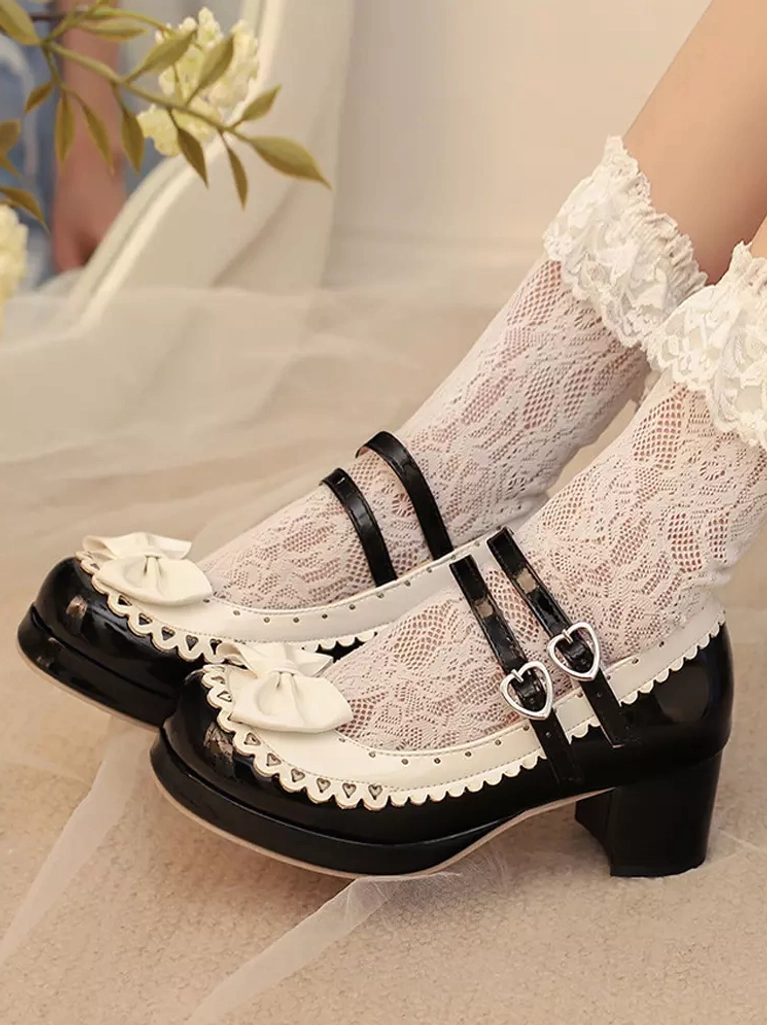 Black and white color block sweet lolita platform shoes overhead angled view with double buckles and chunky block heel paired with ruffled lace socks