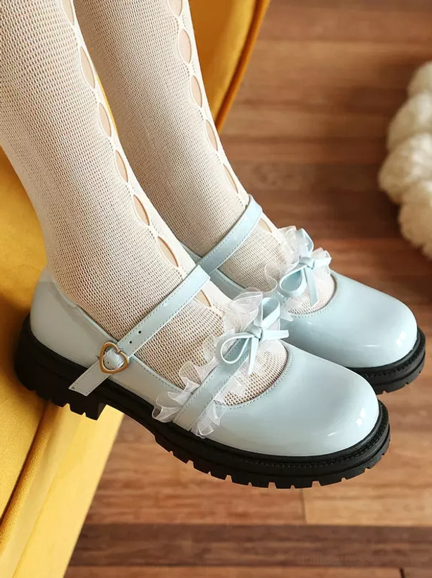 Sweet lolita mary jane shoes detail shot showcasing bow embellishment craftsmanship and ankle strap buckle mechanism