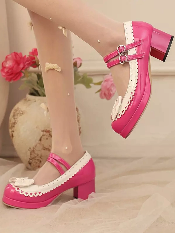 Side dynamic view of hot pink sweet lolita platform mary jane shoes on model with scalloped white trim and single bow embellishment near indoor flower vase