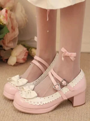 Model wearing light pink sweet lolita platform shoes with chunky block heel and double ankle straps paired with sheer stockings featuring bow accents, low front partial view showcase