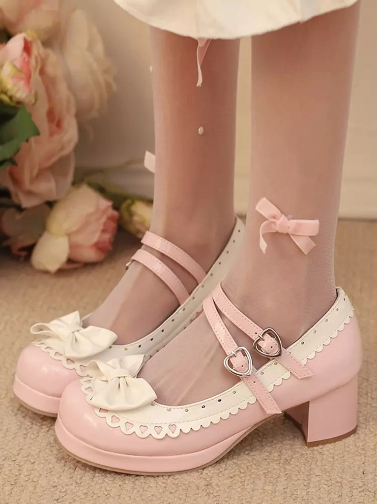 Model wearing light pink sweet lolita platform shoes with chunky block heel and double ankle straps paired with sheer stockings featuring bow accents, low front partial view showcase