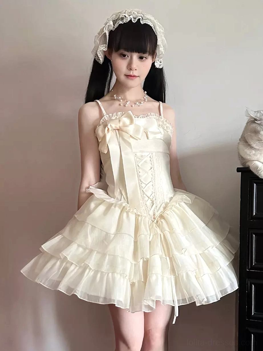 Ivory corset Lolita mini dress full-body front view with model wearing matching lace hair headband, showing tiered ruffled tulle skirt and lace-up bodice detail