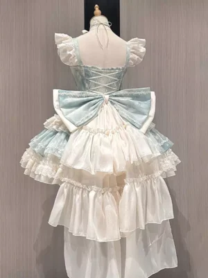Sweet Lolita party dress back view showcasing lace-up back closure, dramatic large back bow, high-low train skirt with layered ruffled hem, and full bell-shaped silhouette in mint and cream pastels