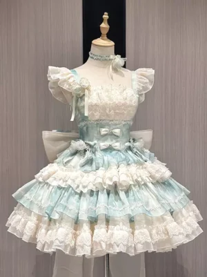 Sweet Lolita dress front view featuring mint blue and cream two-tone design with ruffled short sleeves, delicate lace-trimmed bodice, tiered frill skirt, and adorable bow choker accent on dress mannequin