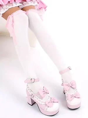 Sweet lolita over-the-knee white cotton socks with pink ruffled lace bow trim cuffs worn with pink frilly skirt and platform heels front view on-foot