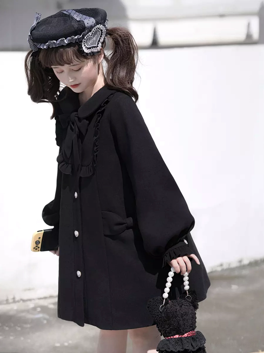 Lolita overcoat fabric texture and embellishment showcase featuring ruffled details, pearl buttons, fabric bow construction quality