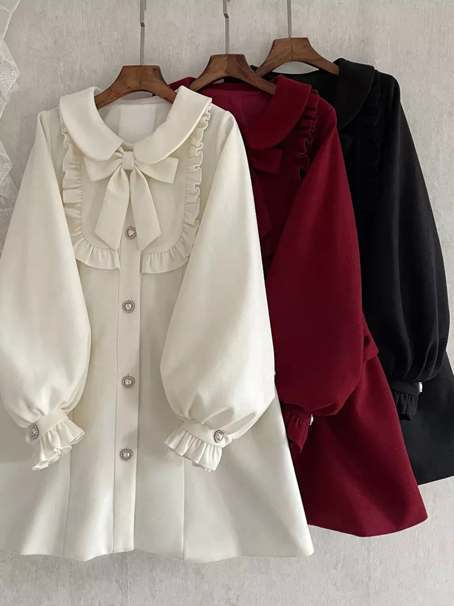 Multi-color lolita overcoats full hanging view on wooden hangers showing three color options cream burgundy black unified lolita design