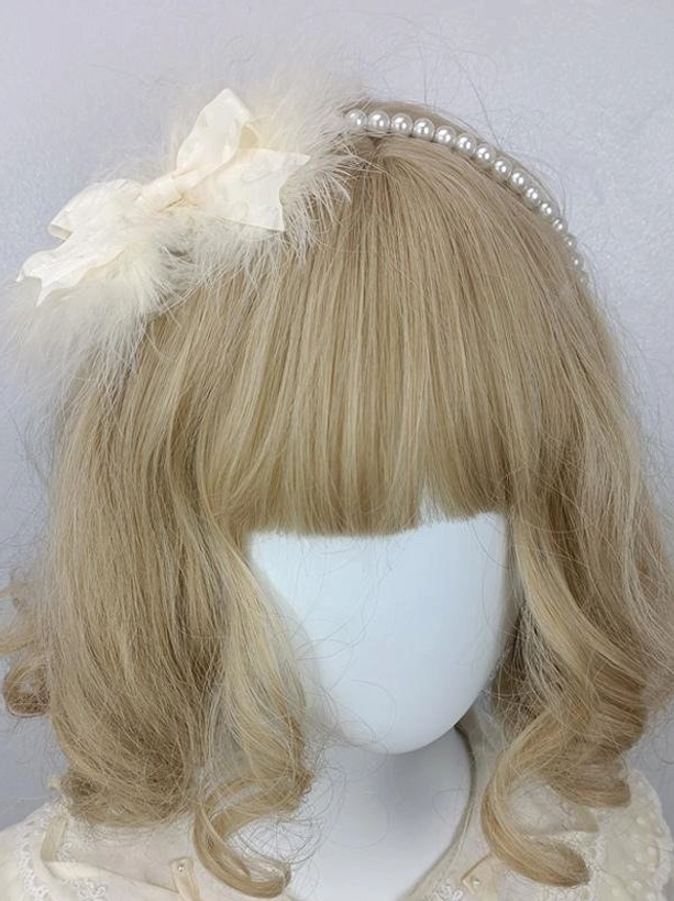 Sweet lolita pearl headband with cream satin bow and fluffy white feather, front three-quarter view on blonde mannequin, pearl-studded headdress accessories