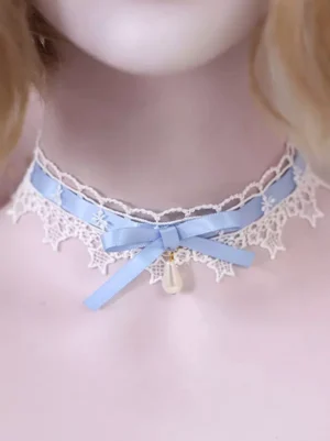 Sweet Lolita lace choker necklace with white star pattern lace trim, light blue satin bow, and drop-shaped pearl pendant on mannequin