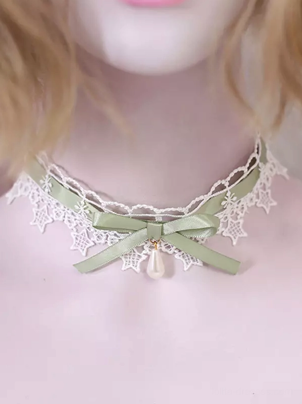 Sweet Lolita lace choker necklace featuring white star lace trim, sage green satin bow, and drop pearl pendant displayed on neck