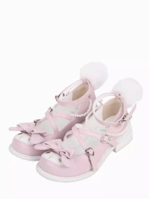 Sweet Lolita flat shoes pink bow round toe featuring decorative cross straps pearl chain and fluffy pom-pom heel details oblique front view