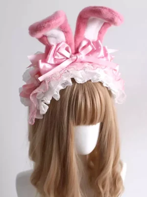 Sweet Lolita pink bunny ear headpiece with white lace frills and satin bow front three-quarter view on blonde wig mannequin