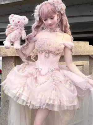 Pink sweet lolita corset dress with decorative bows and fitted waist detail, model holding pink teddy bear on stone balcony, romantic aesthetic