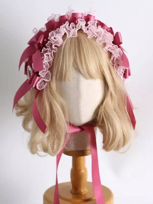 Sweet lolita pink rose red headdress with ruffled lace bows front view on blonde mannequin